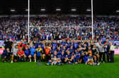 Wakefield Trinity players, staff and families pose for a team picture in front of their fans following last weekend's semi-final win at Wigan Warriors. Picture by Allan McKenzie/SWpix.com.