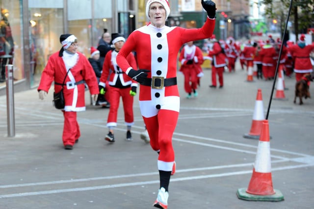 Richard Hayes, centre, was the first person to complete the Santa Dash this year.