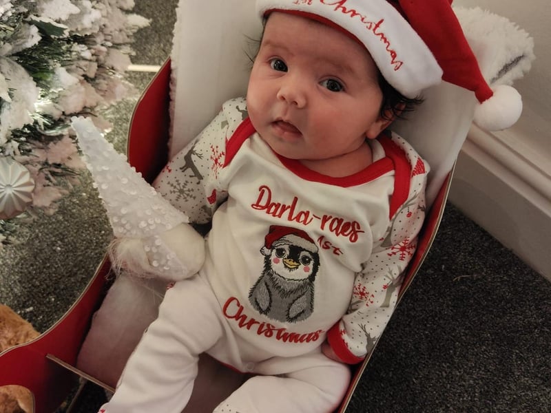 Six week old Darla-Rae in a festive onsie. Submitted by Terri Lockwood.