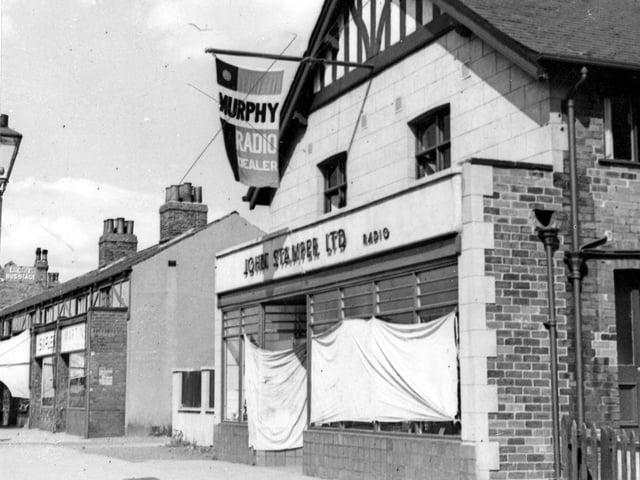 J. Stamper Ltd. radio dealer on Station Road pictured in August 1947. Above the shop is a flag pole with flag advertising Murphy radios. The shop windows are draped with sheets.