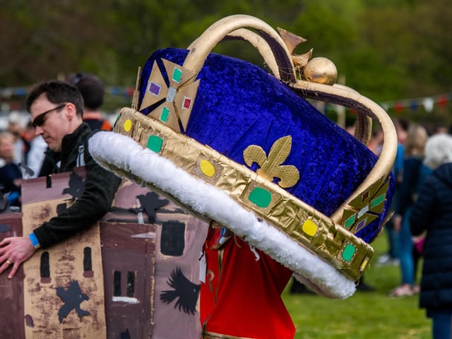This reveller had a giant crown to mark the forthcoming coronation of King Charles III.