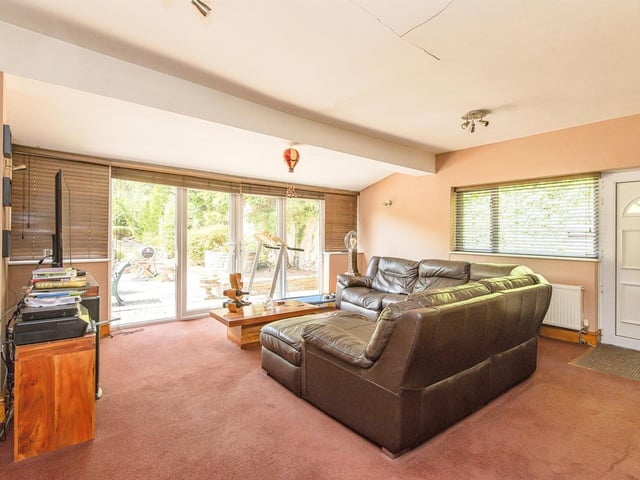 A relaxing room with double doors out to the garden.
