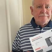 Frank Moane, 73, pictured with the fine he received for stopping at Leeds Bradford Airport.