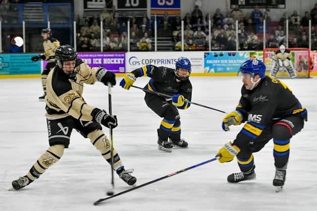 DERBY DUEL: Hull's Beau Reeder fires in a shot on the Leeds goal, watched by the Knights' defenceman, Sam Dunn. Picture: Amy Blossom/Seahawks Media.