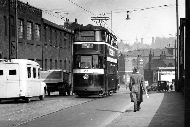 Wellington Road, looking towards the junction with Wellington Street on the right and the bottom of Kirkstall Road on the left. Tram no.562 is seen on route no.15 to Whingate. The industrial building on the left is Fairburn Lawson's Engineering Works. The photographer is standing on Wellington Bridge, which was doubled in width in the 1970's. On the extreme right today would be the slip road by the side of the former YEPheadquarters and in the middle background today, would be the Inner Ring Road.