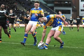 Jake Connor scores for Leeds Rhinos against Wests Warriors in the Challenge Cup third round last February. Picture by Steve Riding.