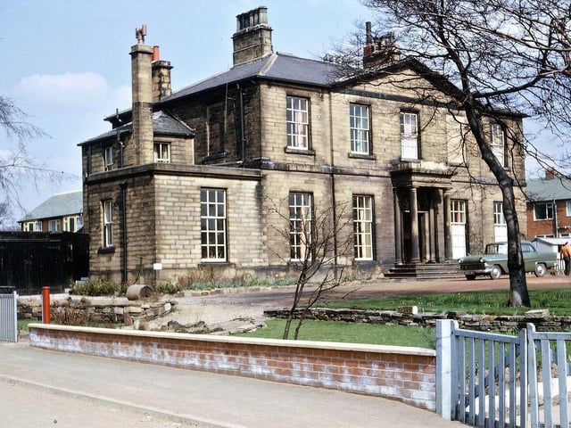 Springfield Hall, surrounded by new housing in Springfield Road and Springfield Avenue. At the time of the photograph it was still used as a private residence for people who worked as managers in different departments of Hield Bros. Ltd. Springfield Mills - namely Mr. J. Roberts and his family at the left, and Mr. H. Metcalfe and his family at the right including the main entrance.