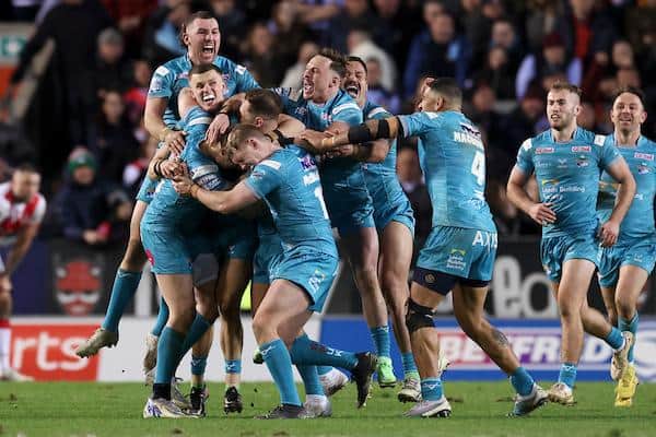 Rhinos players celebrate Blake Austin's 80th-minute winning drop goal at St Helens in March. Picture by Paul Currie/SWpix.com.