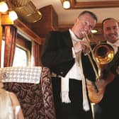 Music while you dine ... the train's resident musicians serenade passengers