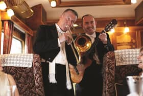 Music while you dine ... the train's resident musicians serenade passengers