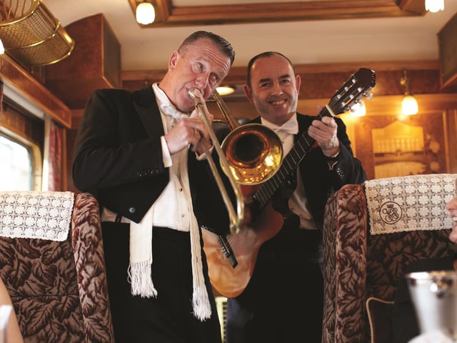 Music while you dine ... the train's resident musicians serenade passengers