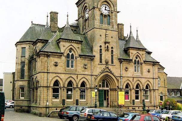Yeadon Town Hall located in the cobbled Town Hall Square pictured in October 2003. Leeds architect, William Hill was the winner of a competition to design the Town Hall and he was one of thirty entrants. He chose a gothic style and the building was completed and opened on June 26, 1880. Over the years the Town Hall has had many uses - The Mutual Improvement Society, the Mechanics Institution an elementary school, a venue for a gentleman's club, a cinema, a library and a clinic