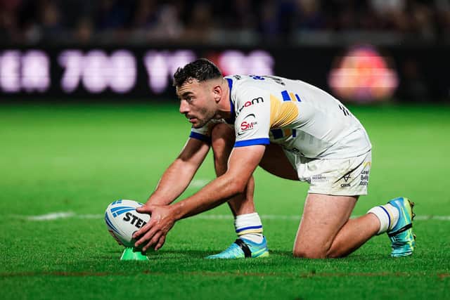 Leeds Rhinos' Jake Connor prepares to land the winning kick against Wakefield Trinity. Picture by Alex Whitehead/SWpix.com.