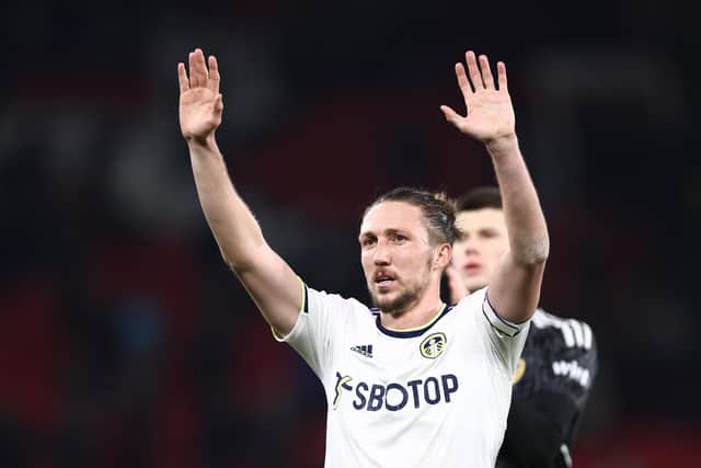 EMBRACING THE CHALLENGE: Luke Ayling salutes Leeds United's travelling contingent after Wednesday night's 2-2 draw against Manchester United at Old Trafford.
Photo by Naomi Baker/Getty Images.