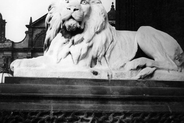 The statue of a lion outside Leeds Town Hall in June 1967. The four lions were added in 1867 nine years after the Town Hall was completed in 1858. The sculptor was William Day Jr.