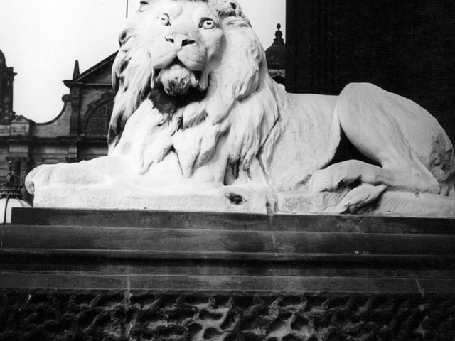 The statue of a lion outside Leeds Town Hall in June 1967. The four lions were added in 1867 nine years after the Town Hall was completed in 1858. The sculptor was William Day Jr.