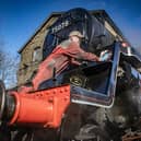 Volunteer Barrie Woodward polishes up an engine early in the morning in the yard in Haworth for the first day of the annual Steam Gala weekend on the Keighley and Worth Valley Railway. Photograph by Tony Johnson