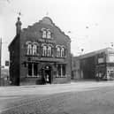 The Woodpecker pub at the junction of Burmantofts Street and York Road pictured in Septemebr 1935. The Woodpecker was no. 1 York Road, selling Ind Coope Beer, its landlord at the time was J. Hegarty. It was built in the early 19th Century and bought by Leeds Council in 1938 for £6,000. It closed in 1939 and a new Woodpecker Inn was built and opened on the opposite corner. On 15th March 1941 the old pub was severely damaged by bombing as was Maurice Adlemans' clothing store at nos. 3-5, seen here on the right advertising a summer sale; both were subsequently demolished. A new Adleman's store was built opposite next to the new Woodpecker.