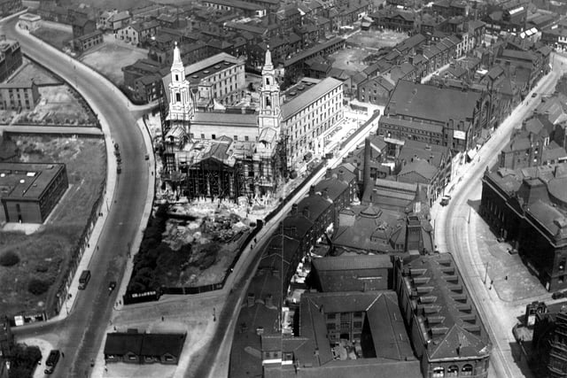 An aerial view looking north west showing the Civic Hall under construction in the centre. The photograph appeared in the Yorkshire Post on June 1933; the Civic Hall was opened on August 23 the same year, by King George V and Queen Mary. The main roads visible are, from left Calverley Street, Portland Crescent and Cookridge Street.