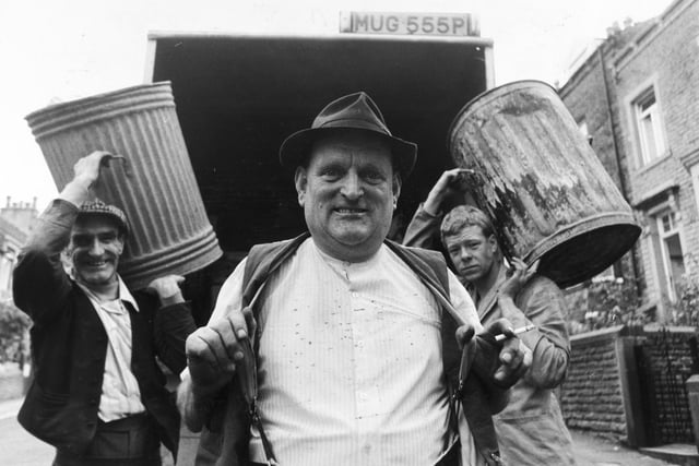 Lambert Alderson is pictured seen with his colleagues Arnold Beck (left) and Mr. Marc Symes (right) after winning a £50 bonus from Craven District Council for the care he had taken collecting rubbish. Pictured in August 1980.