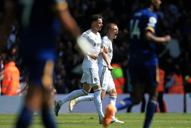 ALL SQUARE: Rasmus Kristensen celebrates putting Leeds United back level. Photo by LINDSEY PARNABY/AFP via Getty Images.