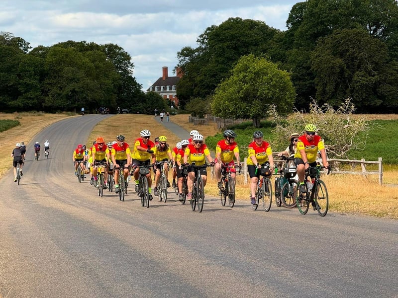 Cyclists pass through Richmond Park.