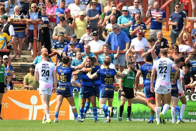 Dejection for Rhinos as Wakefield celebrate. Picture by Simon Hulme.