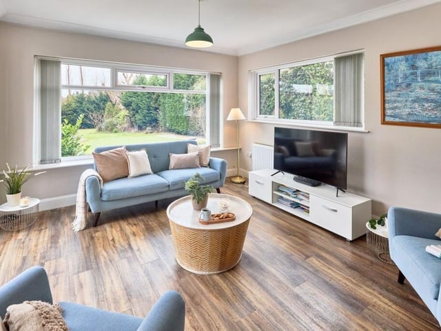 The sitting area boasts panoramic views and access to the garden.