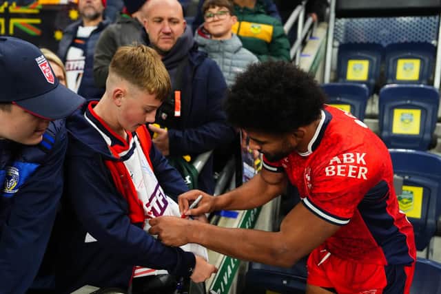 Leeds Rhinos' Kallum Watkins signs a fan's shirt following the third Test loss to Australia at AMT Headingley. Picture by Olly Hassell/SWpix.com.