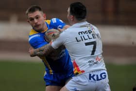 Corey Johnson is tackled by Jordan Lilley during Leeds Rhinos' pre-season clash with Bradford Bulls at Odsal on January 28. Picture by Steve Riding.