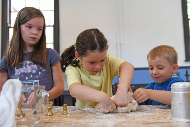 Children enjoy making bread and porridge in the kitchen at Ripon Workhouse Museum after its reopening following a £2.8m renovation. (Picture Gerard Binks)