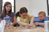 Children enjoy making bread and porridge in the kitchen at Ripon Workhouse Museum after its reopening following a £2.8m renovation. (Picture Gerard Binks)