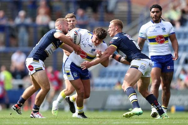 Mikolaj Oledzki, right and teammate Jarrod O'Connor tackle Jordy Crowther in Rhinos' win over Warrington last week. Picture by John Clifton/SWpix.com.