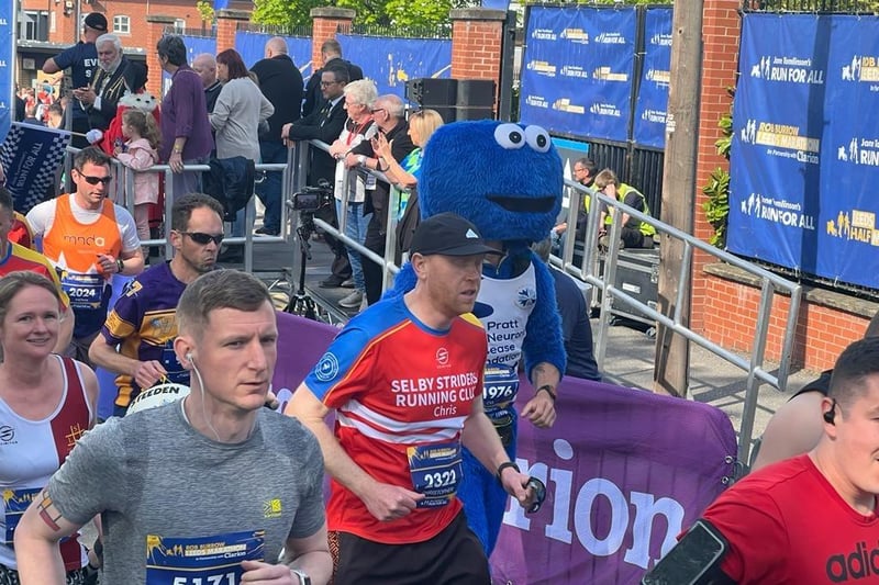 A runner dressed as Cookie Monster joins the other participants.
