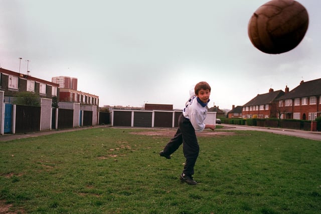 Football crazy Darryl Carrington plays the beautiful game on the grass behind his home on Parkway Vale in Seacroft in April 1997. He wrote to the council asking for a football pitch to be built on the area.