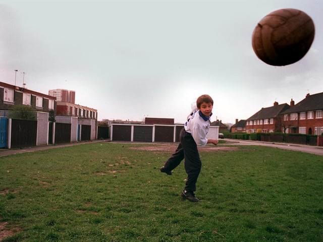 Football crazy Darryl Carrington plays the beautiful game on the grass behind his home on Parkway Vale in Seacroft in April 1997. He wrote to the council asking for a football pitch to be built on the area.