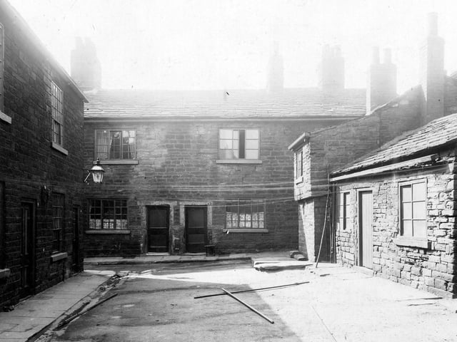 Located off Woodhouse Cliff, stone cottages which were Smith's Court. Pictured in June 1913.
