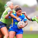 Kaiya Glynn is tackled by Warrington Wolves' Danielle Bound and Sammi Simpson during Leeds Rhinos' Challenge Cup quarter-final win at AMT Headingley last weekend. Picture by Olly Hassell/SWpix.com.