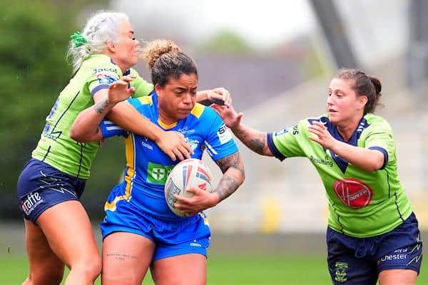Kaiya Glynn is tackled by Warrington Wolves' Danielle Bound and Sammi Simpson during Leeds Rhinos' Challenge Cup quarter-final win at AMT Headingley last weekend. Picture by Olly Hassell/SWpix.com.