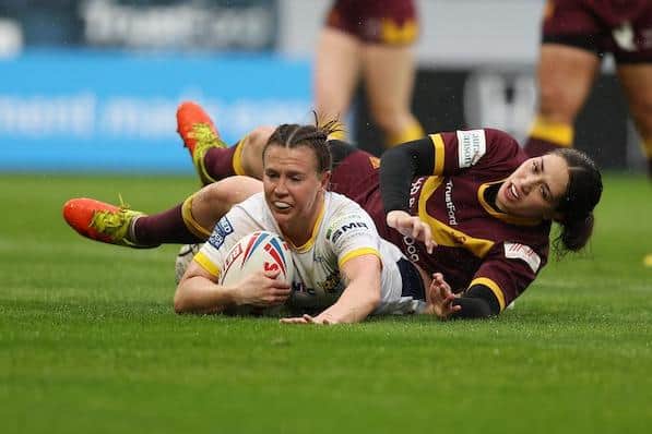 Georgia Hale scores for Rhinos in their Super League win at Huddersfield. Picture by John Clifton/SWpix.com.