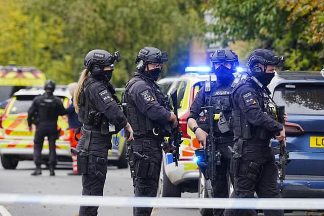 Armed police officers at the scene near the Heaton Park Hebrew Congregation synagogue in Crumpsall, Manchester, where two people died in a suspected terror attack by a man who was shot dead by police: