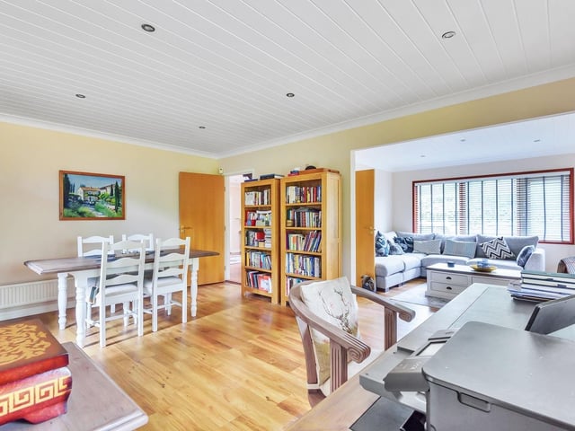 Sitting, dining and work space flow one to another in this light and spacious interior.