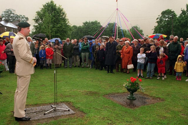 Canadian exchange officer, Major Mark Sellars addresses onlookers before unveiling a plaque by the green at Burley in Wharfedale in June 1997 commemorating the death of 20 Canadian soldiers who were killed in a road accident in the village in 1944.