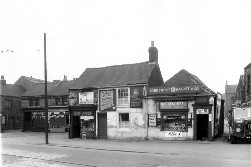 Busnesses on Balm Road in April 1959. On the left is Harry Catchpole, house furnisher,  then a greengrocers. Continuing right Ernest Brook, book and store repairs can be seen and an off licence.