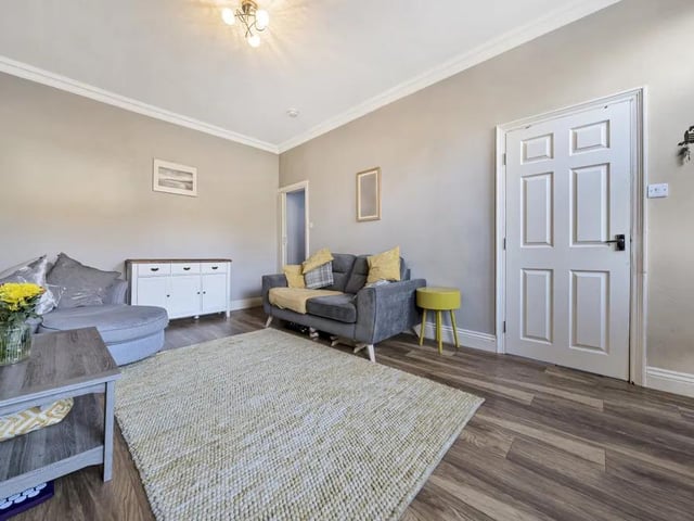There is a feature wall with charming chimney breast intact (making the possibility of installing a wood burning fire good).