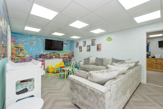 This large room is ideal as a cinema rooom, play room, or alternative.