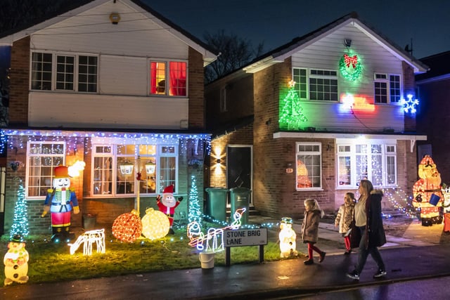 The lane radiates warmth and Christmas joy as each house becomes a glowing masterpiece.