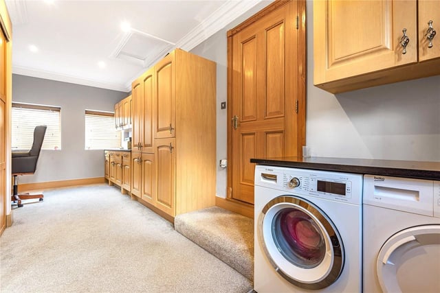 A door from the pantry leads to a downstairs shower room and sizable utility room/office, with fitted furniture and storage cupboards and plumbing for washing machine and tumble dryer.