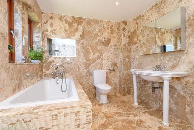A stunning, fully tiled bathroom