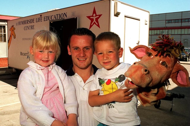 Leeds RL player Francis Cummins with Richmond Hill Primary School pupils Samantha Riley and Martin Purcell at the launch of the  'Life Education Centre' at Elida Faberge in Seacroft in July 1996. The children are holding Harold the Giraffe.